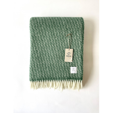 Grønt vævet tæppe